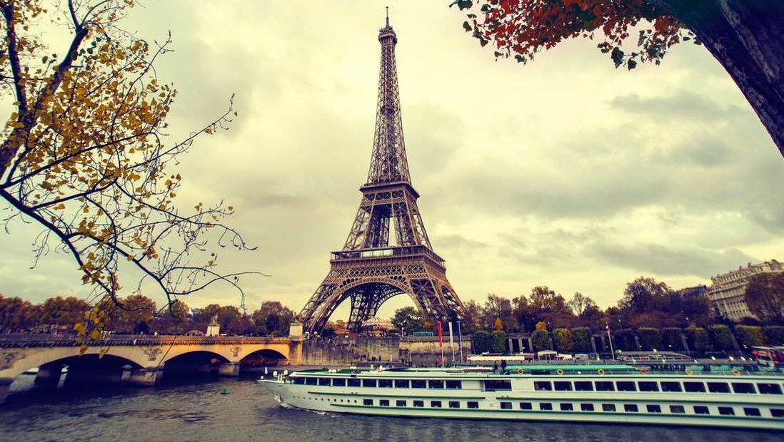 Boat cruise along the Seine in front of the Eiffel Tower in Paris